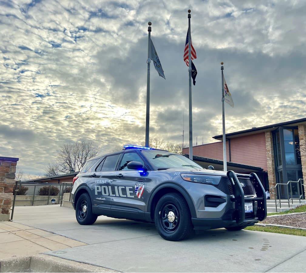 An Itasca Police vehicle sitting outside the police building